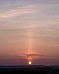 Sun pillar above setting sun at 1823 GMT on 21 March 2003. View from Gaerwen towards Holyhead. Photo: © D Perkins.