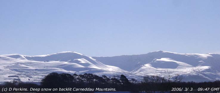 Deep snow on the backlit Carneddau, Foel-fras to C. Dafydd, on 3 March 2006.