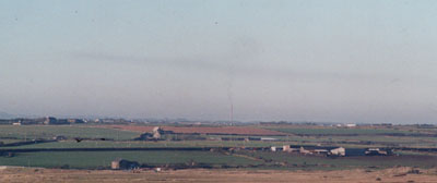 In unusual weather  on 13 January 2001 smoke from the 400ft stack (near centre of photo) at Anglesey Aluminium lingering over NW Anglesey. Photo: © 2001 D. Perkins