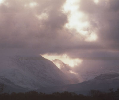 Fresh snowfall in the Nant Ffrancon Pass with crepuscular rays on 10 Feb 2000.