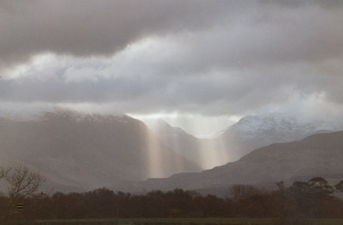 Crepuscular rays in the Nant Ffrancon valley as seen from Llansadwrn.