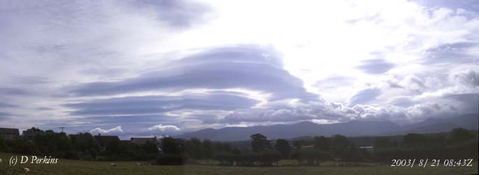 Complex cloud formations including piles-of-plates viewed across the Menai Strait towards the Snowdonia Mountains on 21 August 2003.
