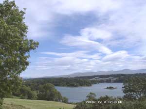 Lenticular orographic wave clouds developed in a clear slot in the lee of the Snowdonia Mountains on 3 September 2004. View towards the Menai Suspension Bridge at high water. 
