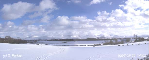 View of Snowdonia covered with snow on the afternoon of 26 February 2004. View from near the weather station in Llansadwrn.
