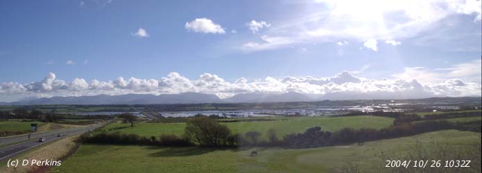 This is not a view of the Menai Strait but is a flooded Malltraeth Marsh on the morning of 26 October 2004. There is a line of stratocumulus clouds over the Snowdonia Mountains that are on the mainland to the S. Photo: &copy: 2004 D. Perkins