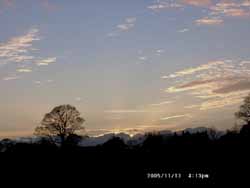 Evening sky at the weather station with distant backlit cumulus. Click for larger. 
