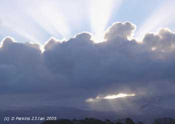 Backlit cumulus with crepuscular rays over the Carneddau on 23 Jan 2005. Click for larger. 