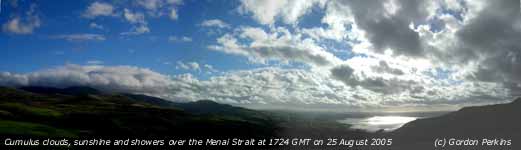 Cumulus clouds on a westerly wind across the Menai Strait viewed from Penmaenmawr. Click for larger. 
