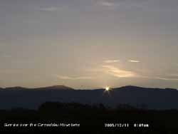 The moment of sunrise over the Carneddau Mountains.