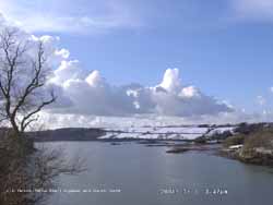 Towering cumulus and snow on Church Island, Menai Bridge.