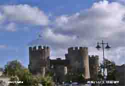 Cumulus clouds over towers of Conwy Castle.