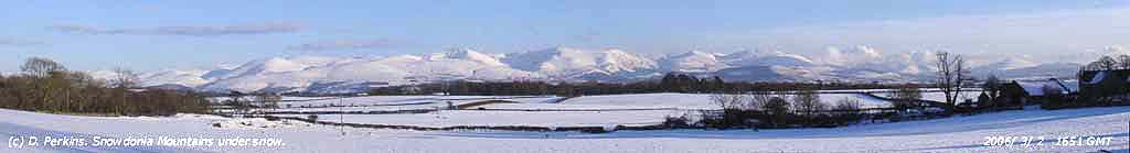 Snowdonia Mountains under blanket of snow.