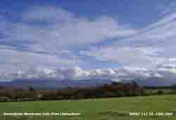 Line of stratocumulus clouds over Snowdonia Mountains viewed from Llansadwrn.