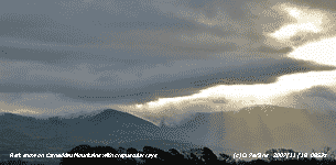 First snow of the season seen on Carneddau Mountains with crepuscular rays.