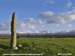 Snowclad Snowdonia seen from Mean Hir (9.5 ft tall standing stone).