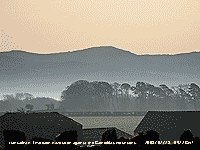 Inversion haze seen against backcloth of the Carneddau Mountains.