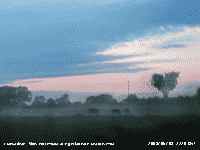 Shallow mist formed on fields at dusk.
