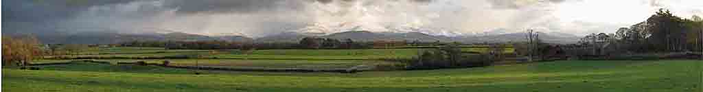Snow showers sweeping across Snowdonia in late afternoon.