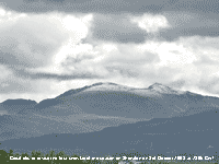Cloud lifts to reveal the first snowfall of the season on Snowdon.