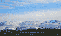 Wind blown snow cover on the Carneddau Mountains.