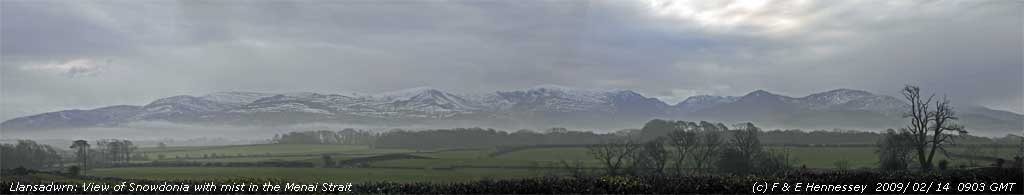 Mist in the Menai Strait and remnant snow on the mountains.