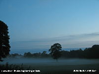 Shallow fog developed on fields at dusk.