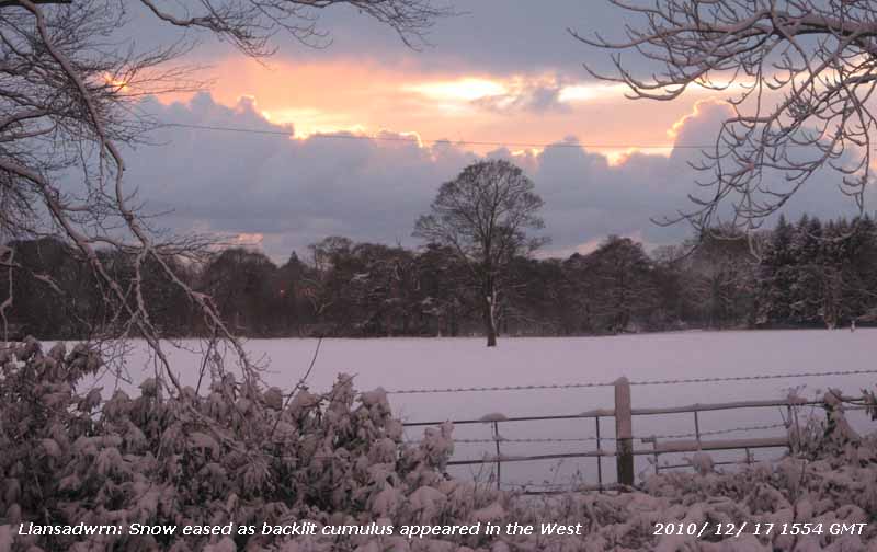 A break in snowfall as backlit cumulus were seen in the West.