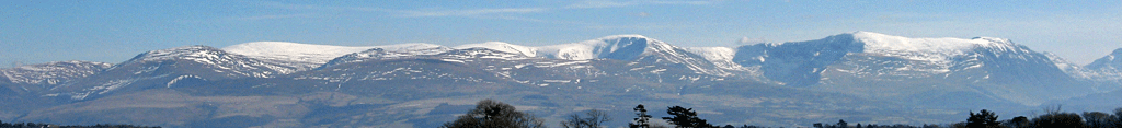 Mountain snow under cirrus clouds.