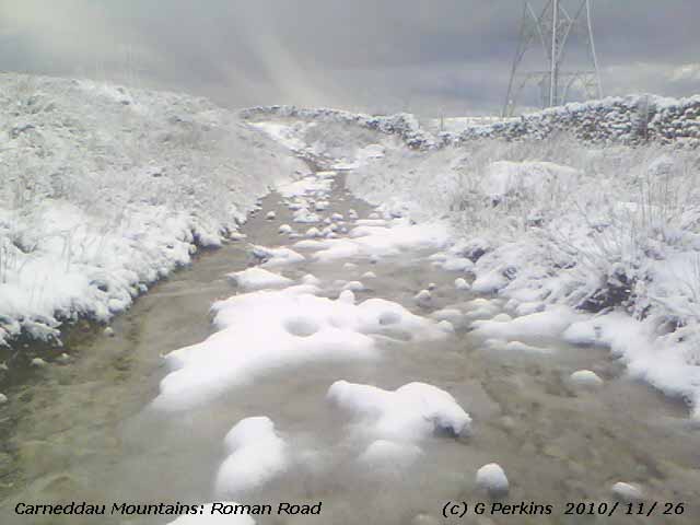 Snow on boulders in a stream on the Carneddau near the Roman Road.