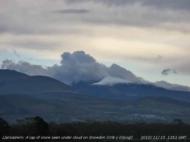 Snow on Crib y Ddysgll under cumulus cloud.