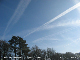 Long expanding contrails to the SE.