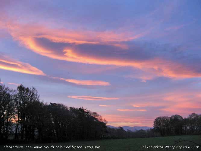 Colourful lenticular clouds before sunrise.