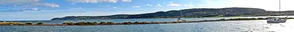 The shingle spit was nearly submerged at the equinocial high tide in Red Wharf Bay.