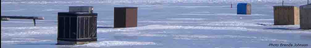 Fishing huts on the frozen St Lawrence River, Canada.