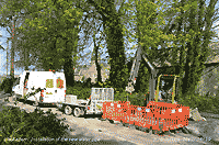 Hi-tech installation of new water pipe near the church.