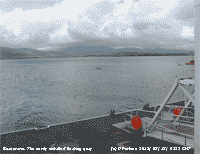 Looking out across the floating pier in Beaumaris at the Menai Strait and Snowdonia.