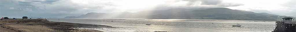 Crepuscular rays viewed across the Menai Strait from Beaumaris.