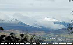 Fresh snow fell on m oun tains in the afternoon.