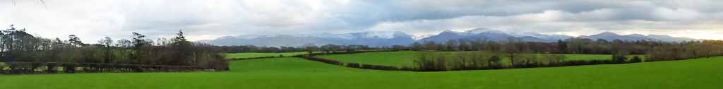 A winter day in Llansadwrn looking at the snowclad mountains.