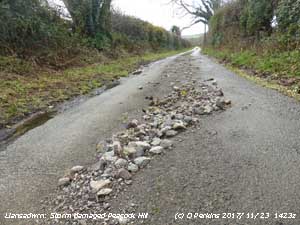Water damaged road side in Llansadwrn.