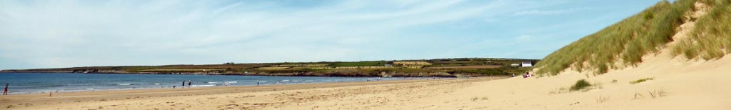 Beaumaris pier and lifeboat station on a cloudy and breezy morning.
