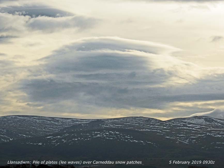 Pile of plates above snow patches on the Carneddau.