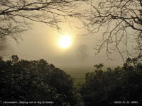 The setting sun in fog at Gadlys.