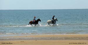 Enjoying a splash at Aberffraw Bay.