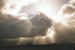 Crepuscular rays through cumulus clouds across the Menai Strait on 31 October. &copy; D. Perkins.