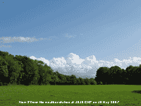 Green trees and grass with stratocumulus cloud to the S. 