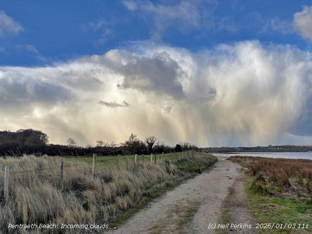 Clouds that brought heavy falls of snow pellets and snow to Llansadwrn.